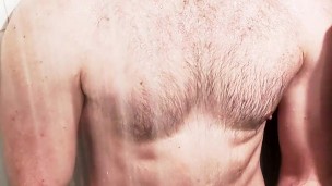 Bearded muscle jock jerks off and gets wet in the gym showers
