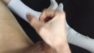 Horny guy in white socks jerks off with lubricant and cums a lot