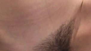 Girl with a very hairy pussy put her leg on the washbasin and pissing in it