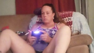 Filming Up Milfs Skirt While She Smokes and Plays Video Games