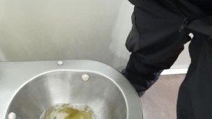 pissing in a public toilet on train