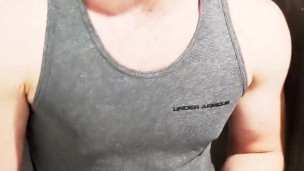 Horny jock plays with his thick cut cock in the gym showers