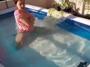 Elegant and flexible babe, swimming underwater in the outdoor swimming pool. 21 1/16
