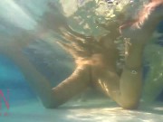 Elegant and flexible babe, swimming underwater in the outdoor swimming pool. 3 1 16/16