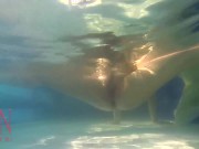 Elegant and flexible babe, swimming underwater in the outdoor swimming pool. 3 2 2/16