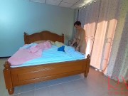 Nudist housekeeper Regina Noir makes the bedding in the bedroom. Naked maid. Naked housewife. 1 2/16