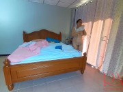 Nudist housekeeper Regina Noir makes the bedding in the bedroom. Naked maid. Naked housewife. 1 3/16