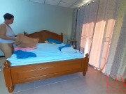 Nudist housekeeper Regina Noir makes the bedding in the bedroom. Naked maid. Naked housewife. 1 4/16