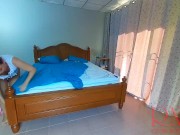 Nudist housekeeper Regina Noir makes the bedding in the bedroom. Naked maid. Naked housewife. 1 7/16