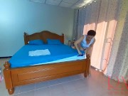 Nudist housekeeper Regina Noir makes the bedding in the bedroom. Naked maid. Naked housewife. 1 8/16