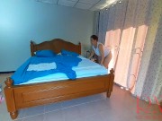 Nudist housekeeper Regina Noir makes the bedding in the bedroom. Naked maid. Naked housewife. c2 14/16