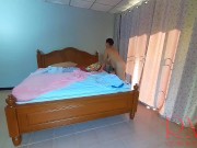 Nudist housekeeper Regina Noir makes the bedding in the bedroom. Naked maid. Naked housewife. c2 2/16