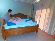 Nudist housekeeper Regina Noir makes the bedding in the bedroom. Naked maid. Naked housewife. c2 7/16