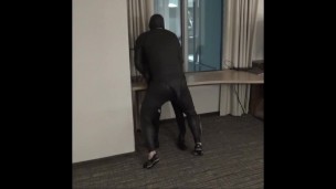 wetsuited guy fucking dummy at hotel window