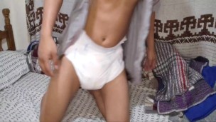 Man wears three diapers and a chastity lock to bed