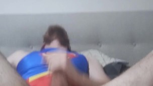 man masterbates in a superman one piece swimsuit