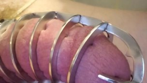 Locked in a metal spiked chastity cage