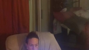 Amateur milf takes off her mini dress and lays on the couch in lingerie playing video games
