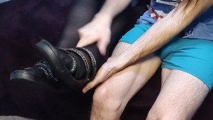 Removing stockings & rubbing her feet after a long day