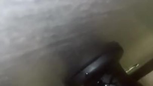 Trying to knot big black dildo