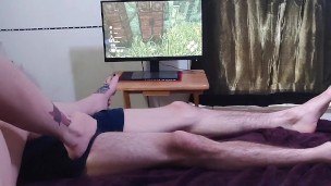 Sneaking footjob into gamer girl's playtime