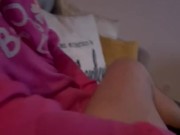 she jerks me off while watching tv and i cum on her leggings