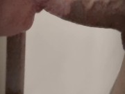 Husband filming his wife giving a blowjob kneeling.