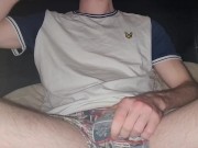 Guy gets horny while smoking so strokes his cock and gets naked 1/16