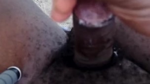 Cumshot after stroking my black uncut cock outdoor