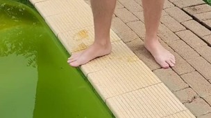 Wanking outside next to swimming pool