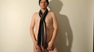 Kudoslong poses in a woollen had and scarf his body and and small penis are shaved smooth
