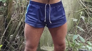 Dude in shorts and boots strips off and cums outdoors