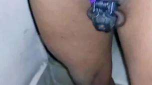 Sissy shemale piss walking while in chastity cage and butt plug
