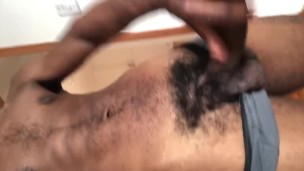 Horny stud strokes his heavy and big cock