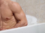 Muscular stud jerking off big cock in bath with a nice cumshot ending