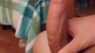 Man plays with his big uncut cock