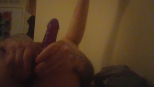 Tattoos guy toys ass with huge dildo