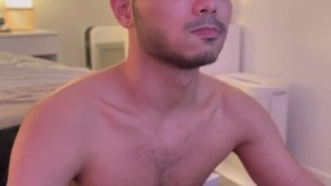 Asian boy stroking cock