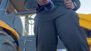 (Fleshbating near a tractor)
