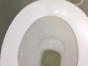 Slim girl in jeans pisses in a public toilet and shows dirty panties