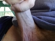 Hot guy hanging out at the park.  Playing with his big dick at a public picnic table