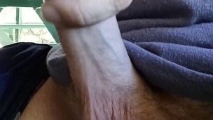 Hot guy hanging out at the park. Playing with his big dick at a public picnic table