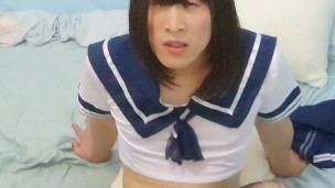 Crossdresser with school uniform with pantyhouse