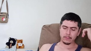 Handsome guy playing with cock and cum