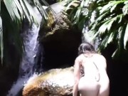 beautiful european girl swims naked in the river 10/16