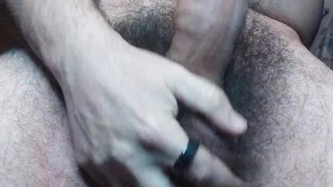 Bearded and hairy guy playing alone with his dick