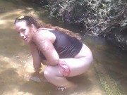 Cute Long Hair Girl pulls down her jeans and panties and pees in popular spring creek