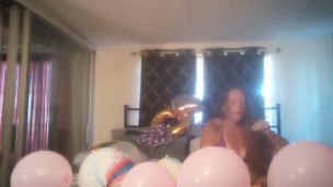 Extremely horny girl takes off her dress and smokes cigarettes and pops balloons naked