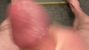 Amateur jerking off in mirror with feet showing
