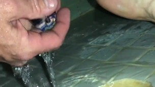 Watch Him Piss and Play With His Ass In The Shower